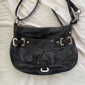 slouchy black leathered shoulder bag with silver hardware and leopard interior